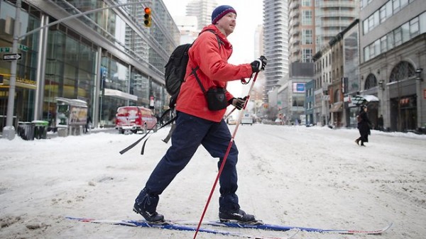 A man uses his cross-country skis on Manhattan 58th Street during his morning commute