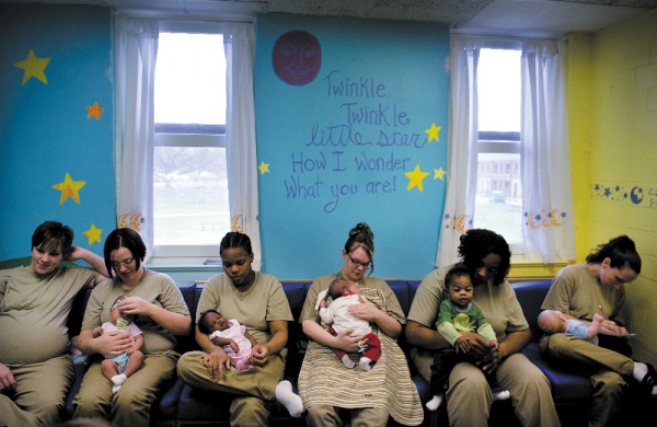 Image: Incarcerated women  hold their babies in a child development class given at the Indiana Women's Prison.