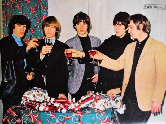 Rolling-stones_-Mick-Keith-Charlie-Brian-and-Bill-make-a-festive-toast-in-British-1960s-magazine-Fab.-700x522