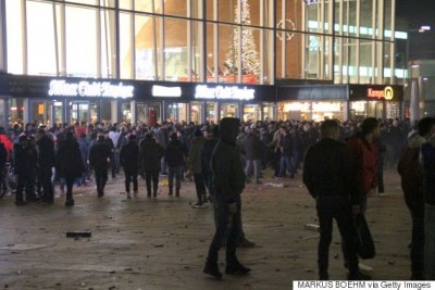 Picture taken on December 31, 2015 shows people gathering in front of the main railway station in Cologne, western Germany. Police in Cologne told AFP they have received more than 100 complaints by women reporting assaults ranging from groping to at least one reported rape, allegedly committed in a large crowd of revellers during year-end festivities outside the city's main train station and its famed Gothic cathedral. / AFP / dpa / Markus Boehm / Germany OUT (Photo credit should read MARKUS BOEHM/AFP/Getty Images)