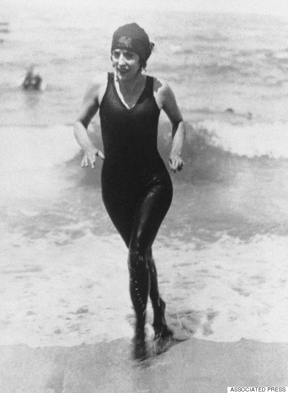 Australian professional swimmer Annette Kellerman walks out of the water on July 27, 1928 at Deauville, France in a complete black bathing suit. (AP Photo)